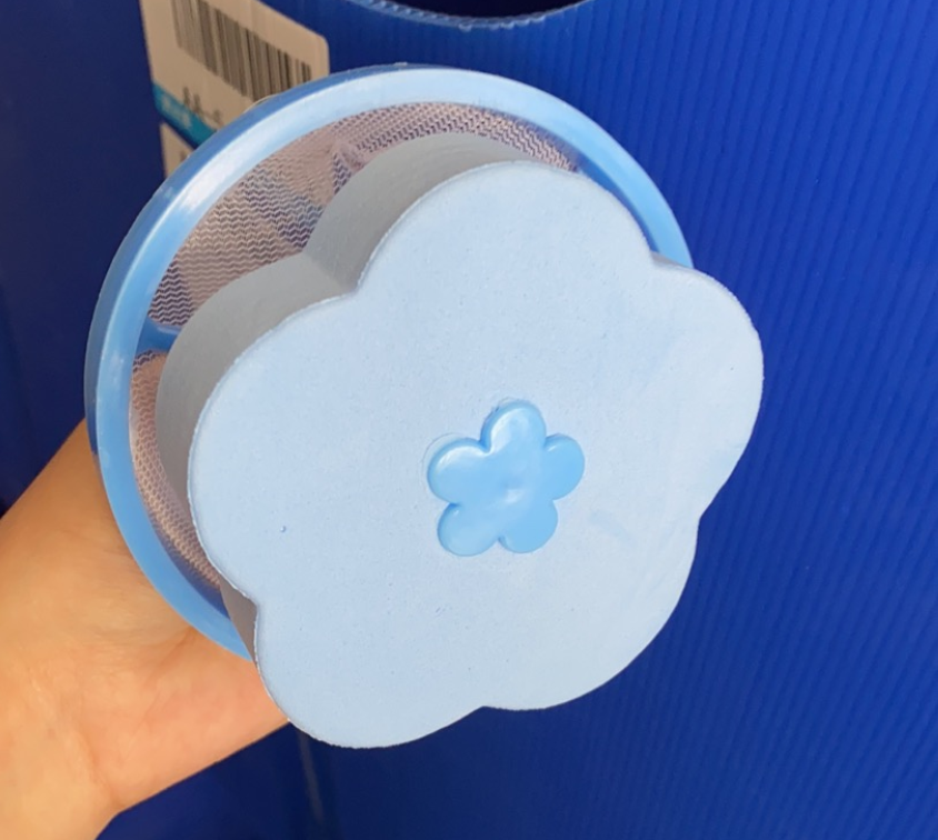 Floating laundry pet hair catcher with collected pet fur