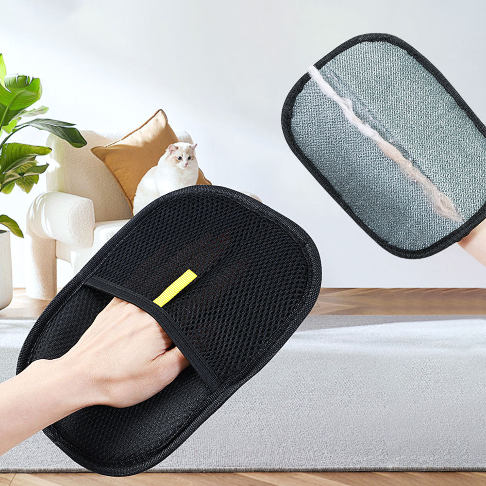 Hand in the mesh pocket of the pet hair remover mitt, with a strip of gathered fur on the fabric side