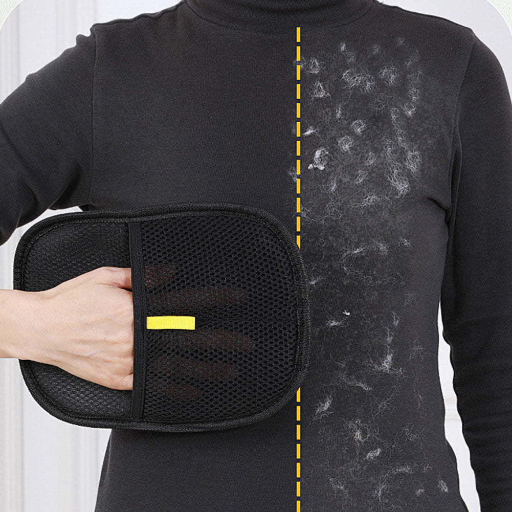 Pet hair remover mitt wiping lint and pet hair off a dark sweater