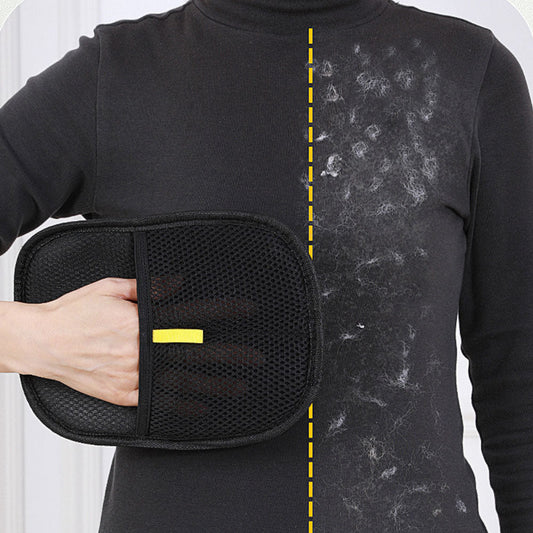 Pet hair remover mitt wiping lint and pet hair off a dark sweater